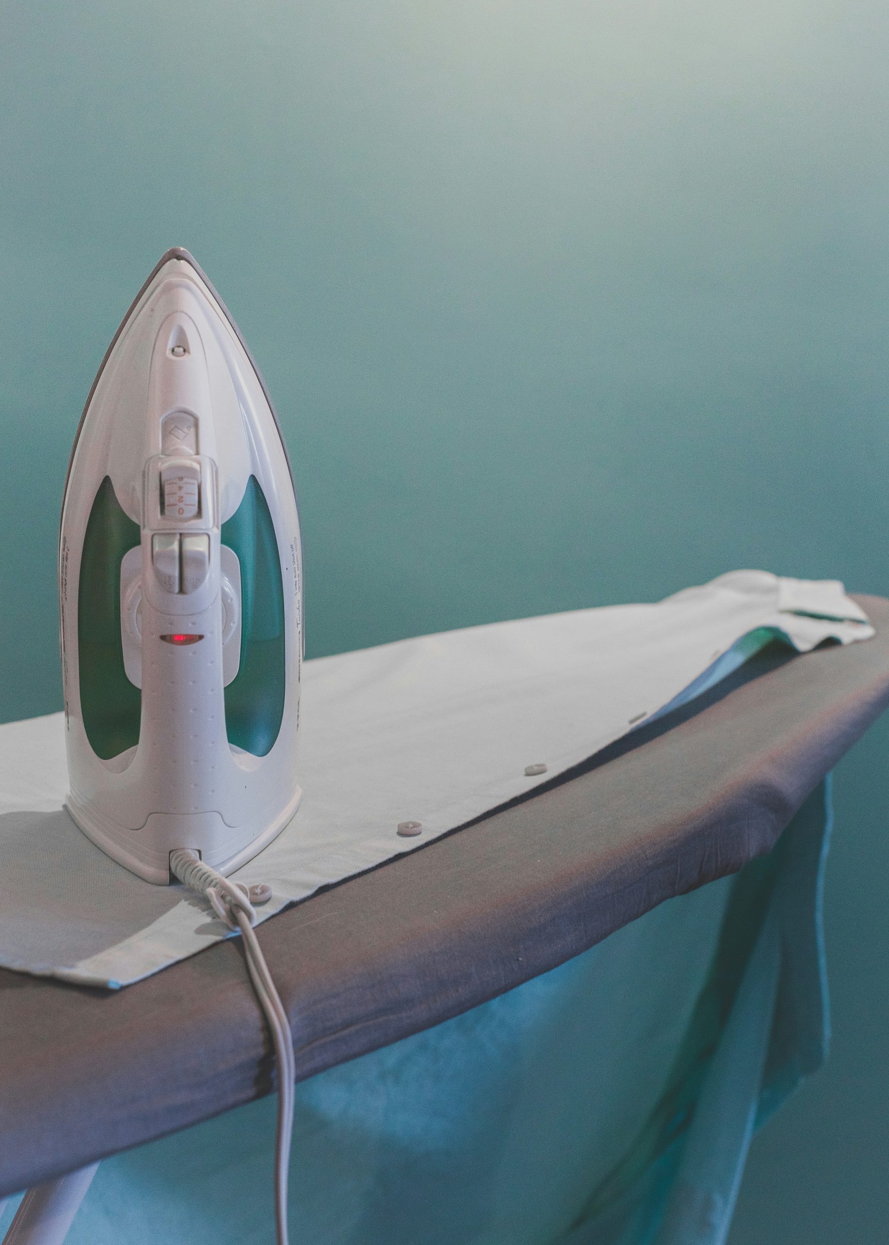 Professional ironing service with neatly pressed clothes delivered to a UK home
